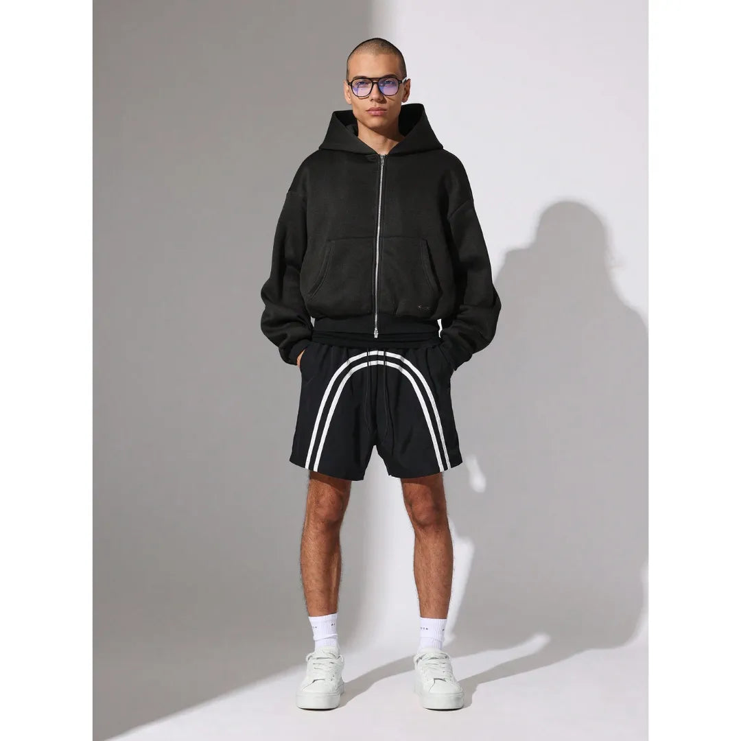 Person wearing black Nylon Race Shorts