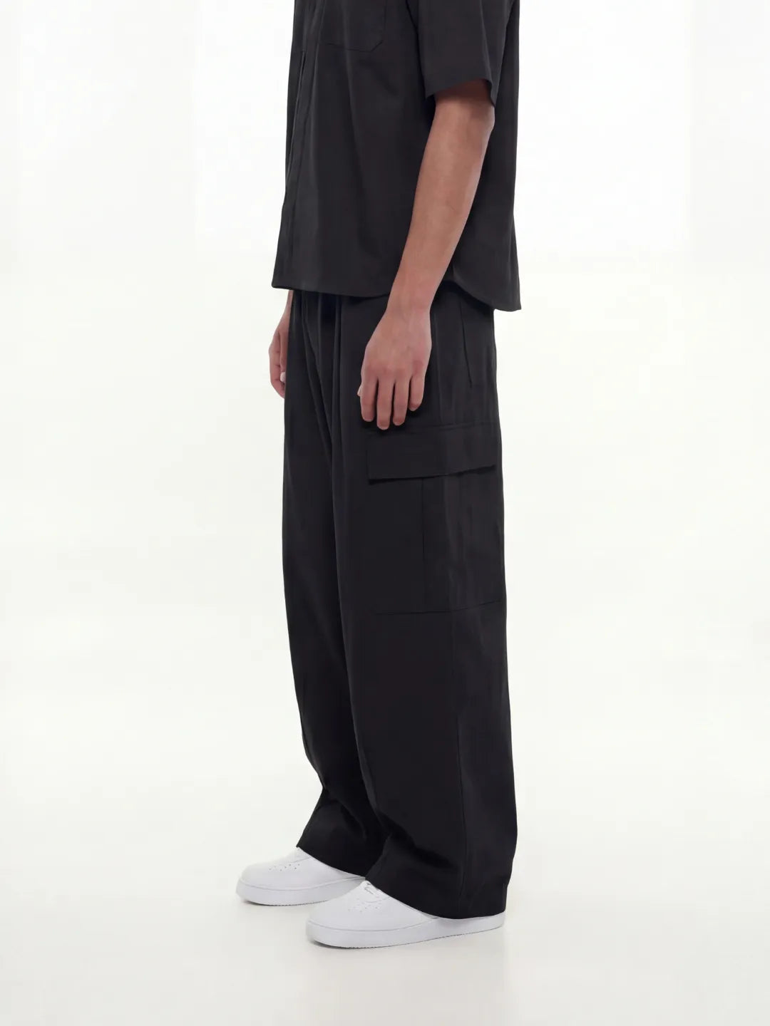 Person wearing a black cargo pants