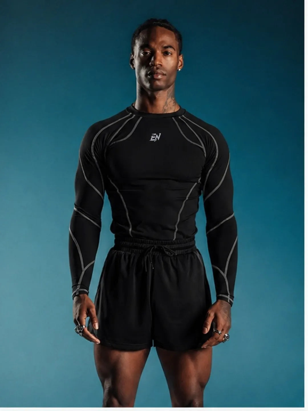 Person wearing a black Compression Full Sleeve T-shirt with a brand logo on a blue background