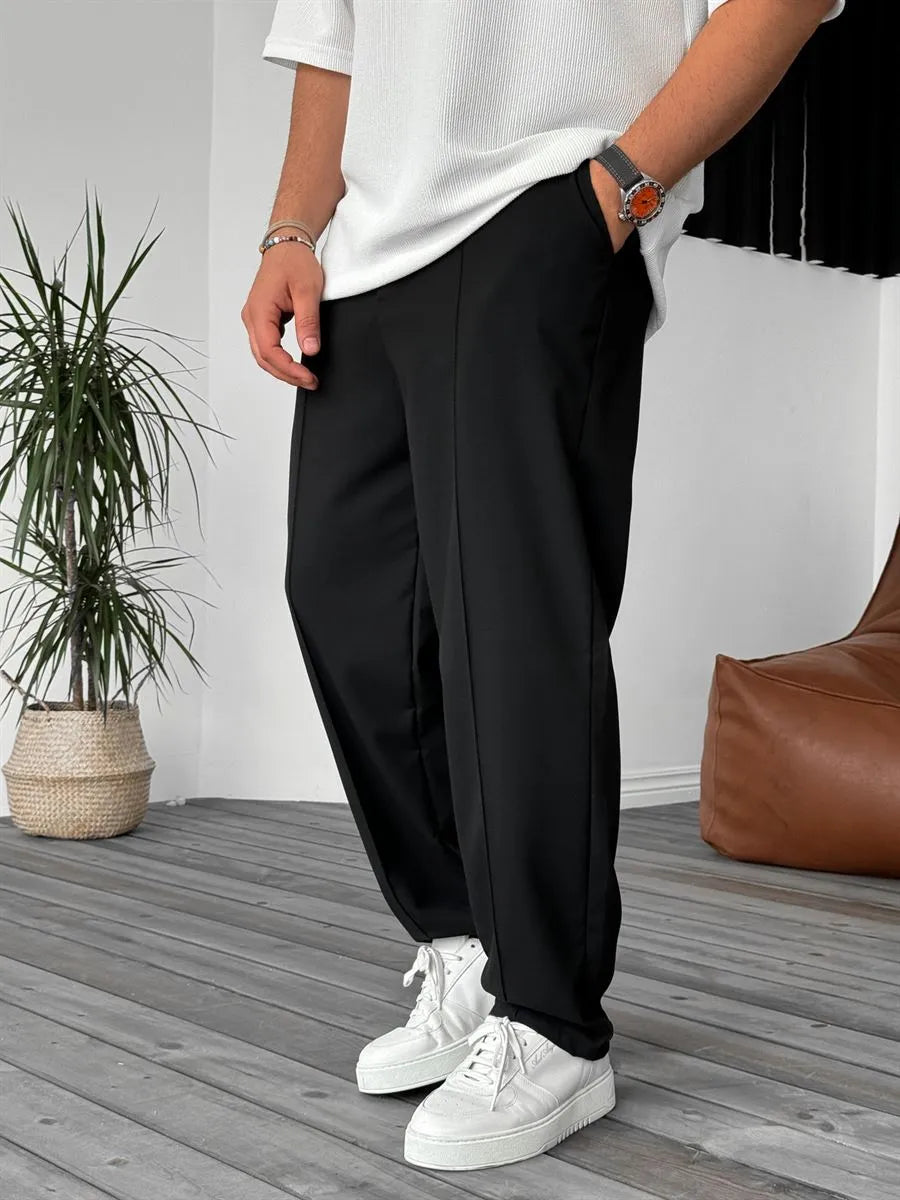 Person wearing black office straight fit pants 