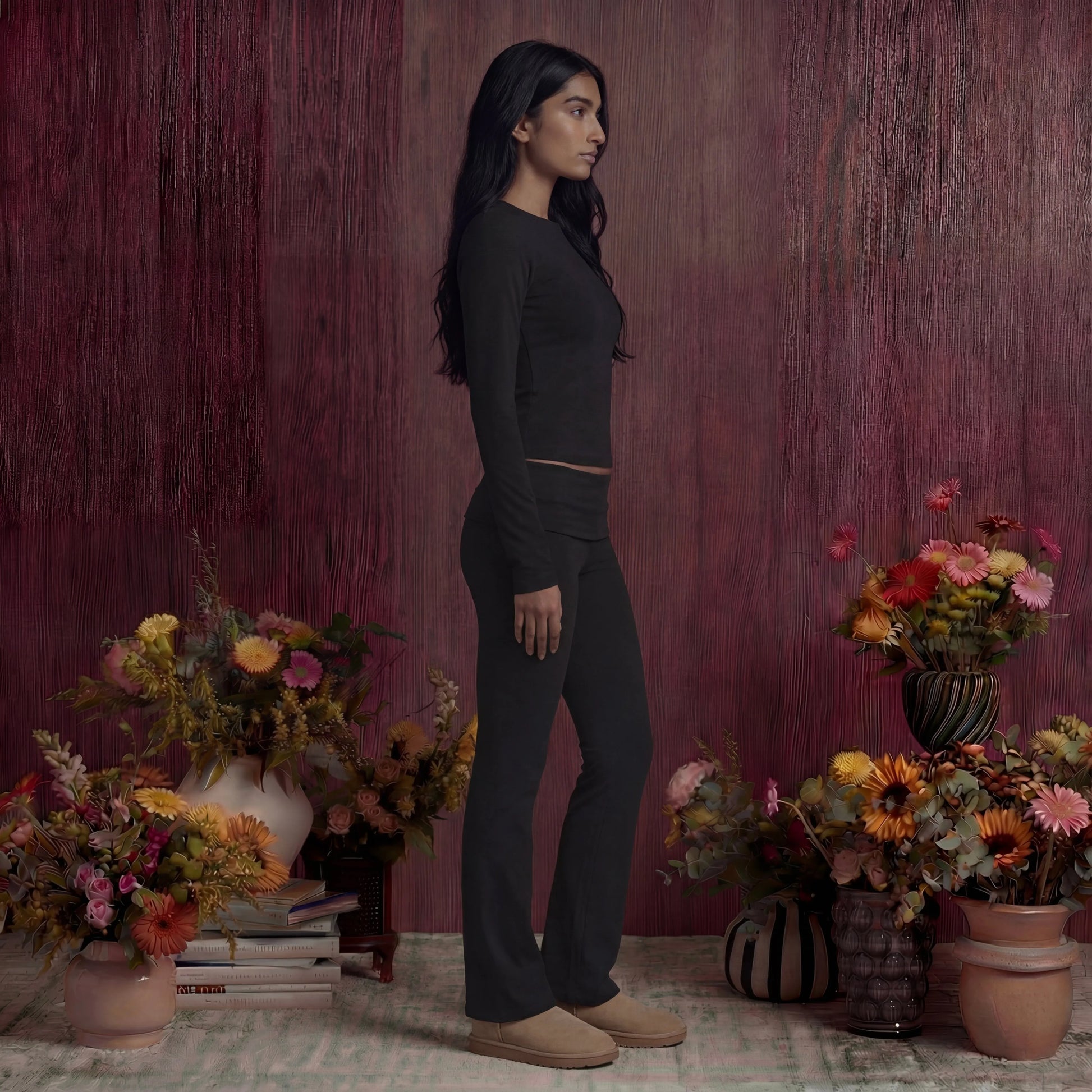 Woman wearing black cotton fold over pants and top