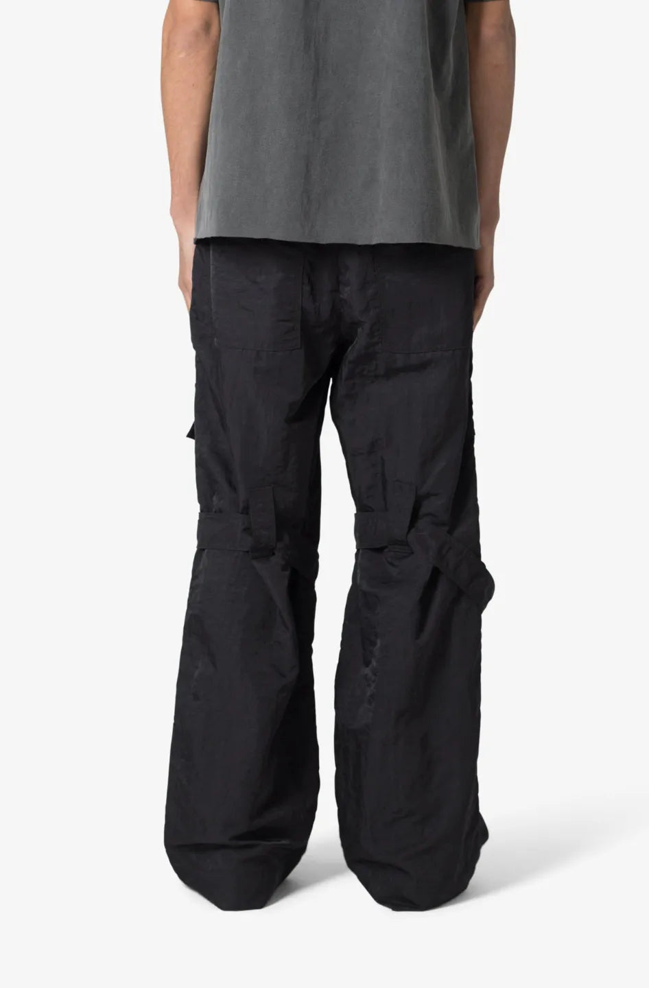 Person wearing black baggy strap cargo pants 