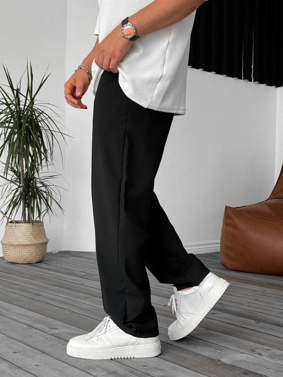 Person wearing black office straight fit pants 