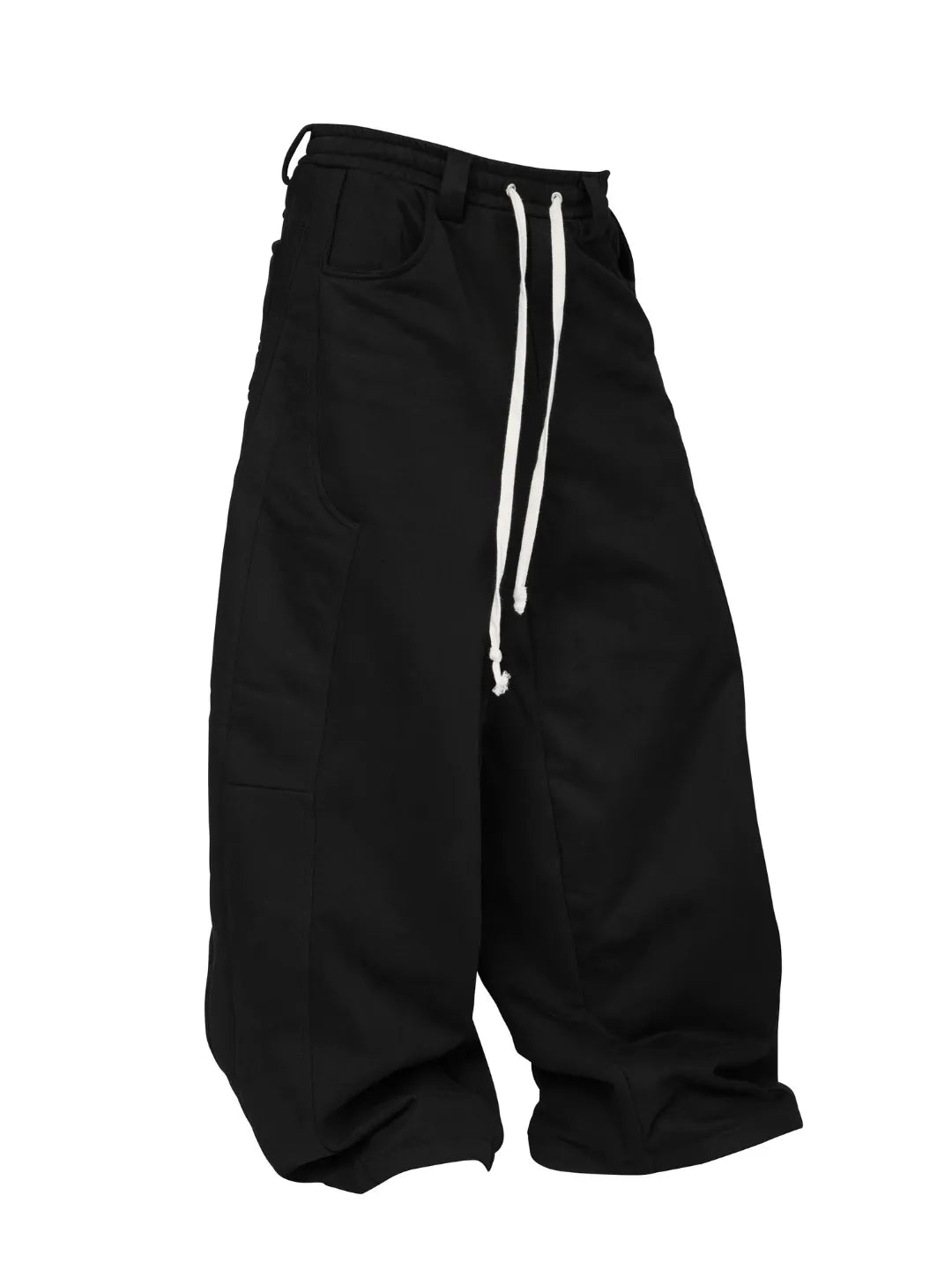 Black sweatpants hanging on a wooden hanger against a white background