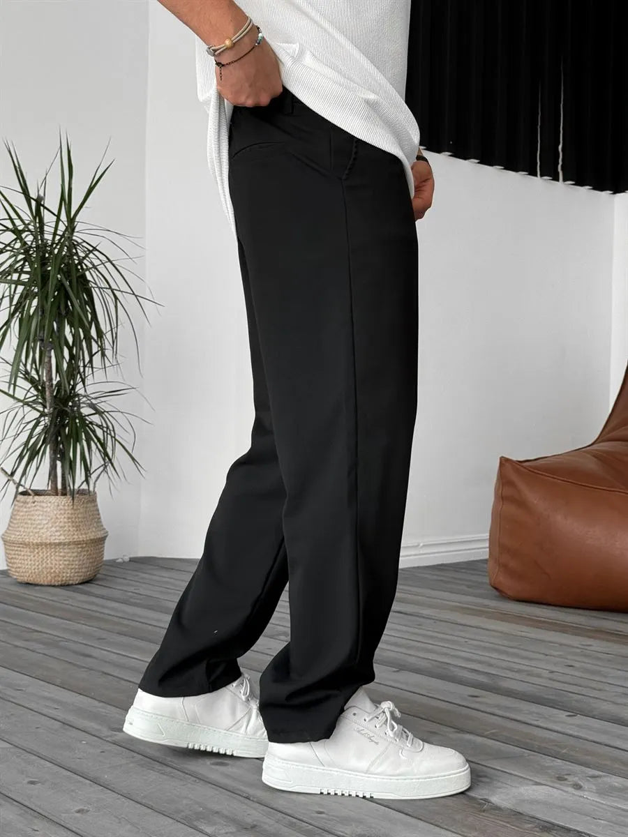 Person wearing black office straight fit pants 