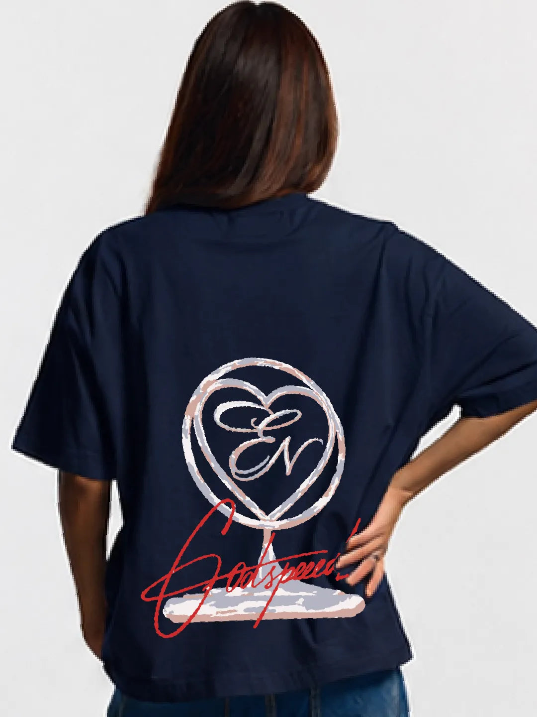 Person wearing a navy blue oversized t-shirt with a logo on the back against a white background