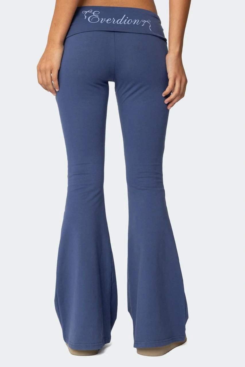 Blue flared pants with 'Everdion' branding on a white background