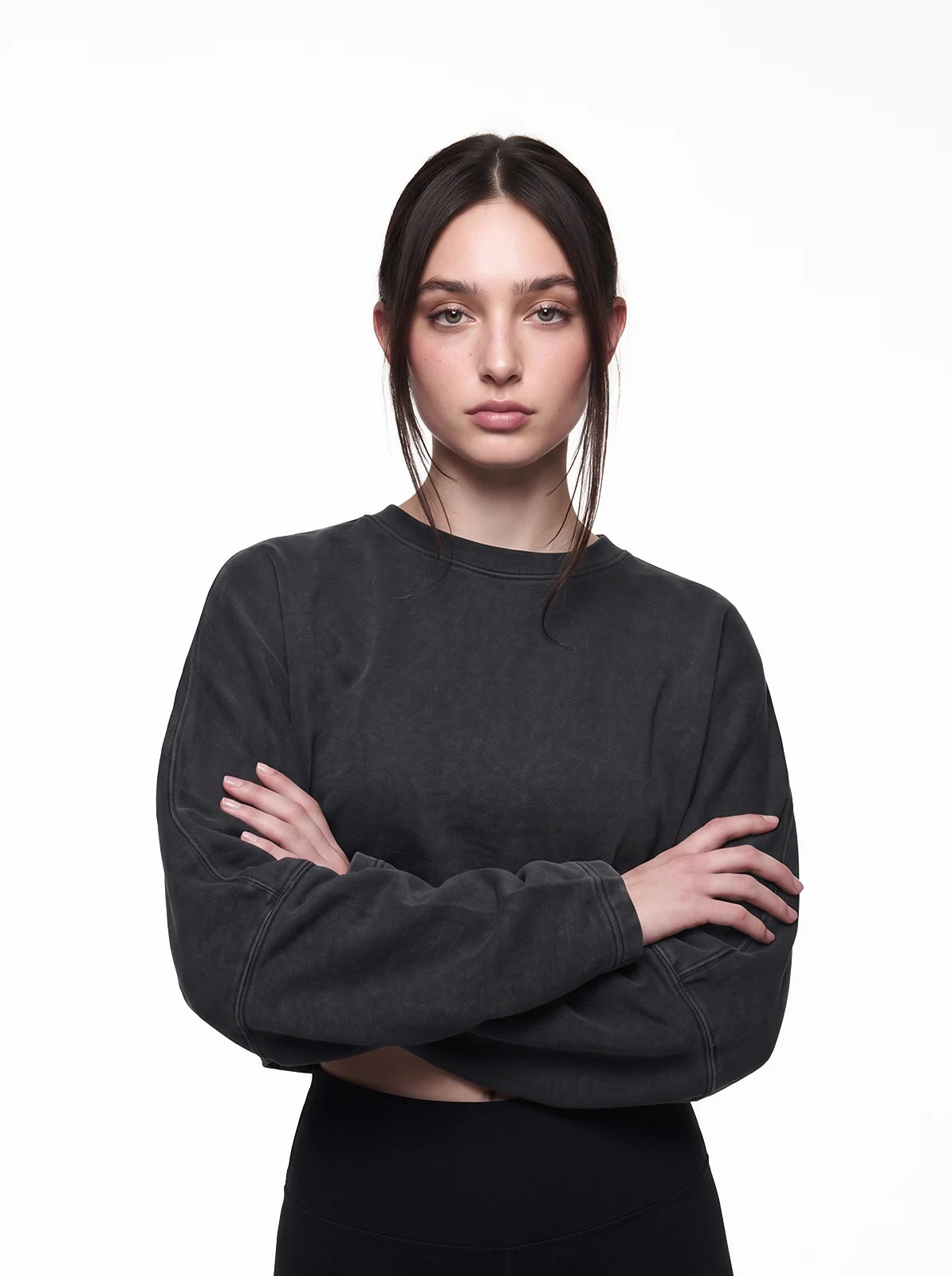 Woman wearing washed black cult cover crop tee