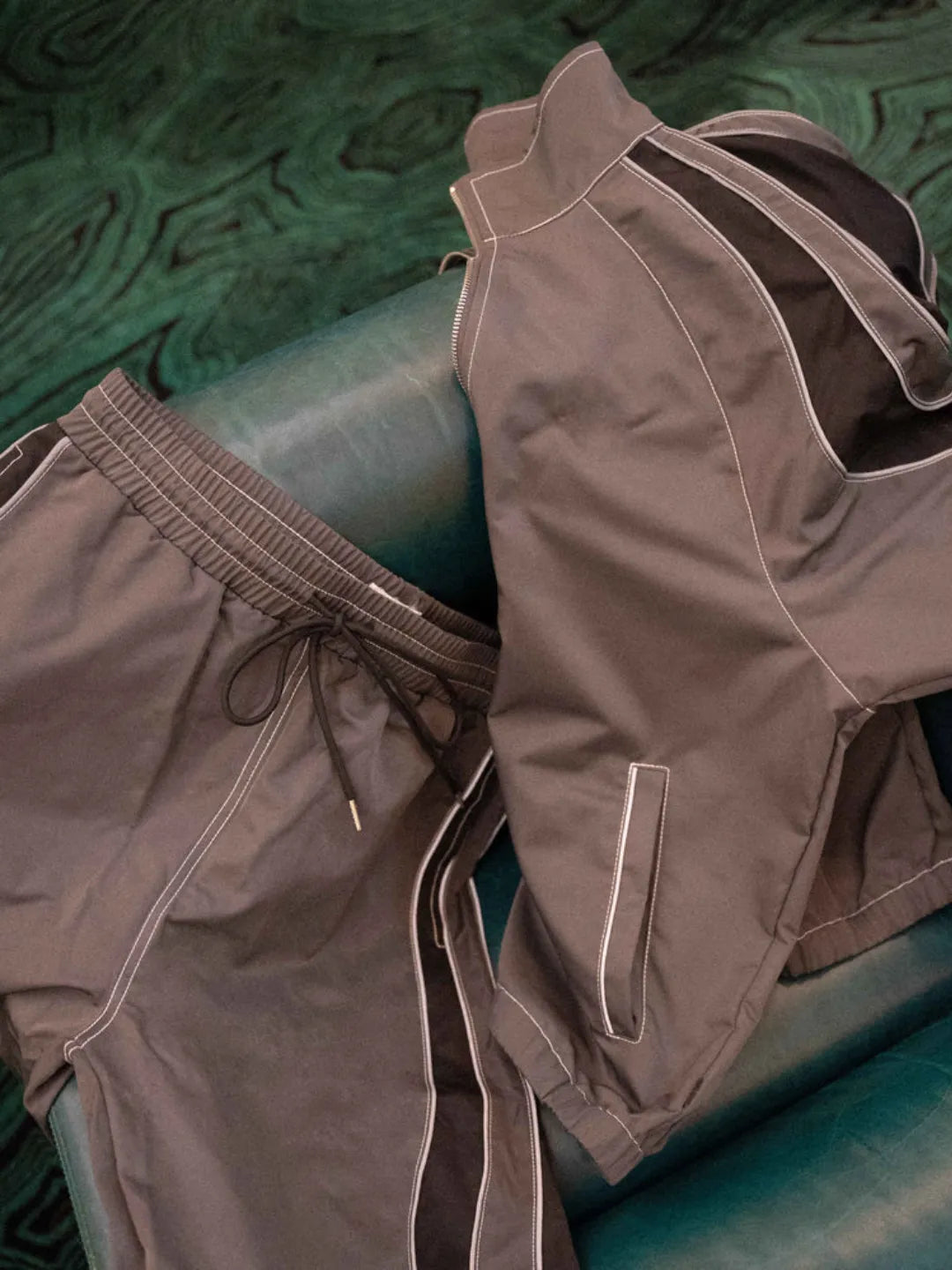 Brown shorts on a green textured surface