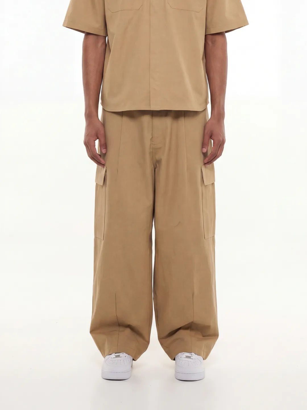 Person wearing beige cargo pants