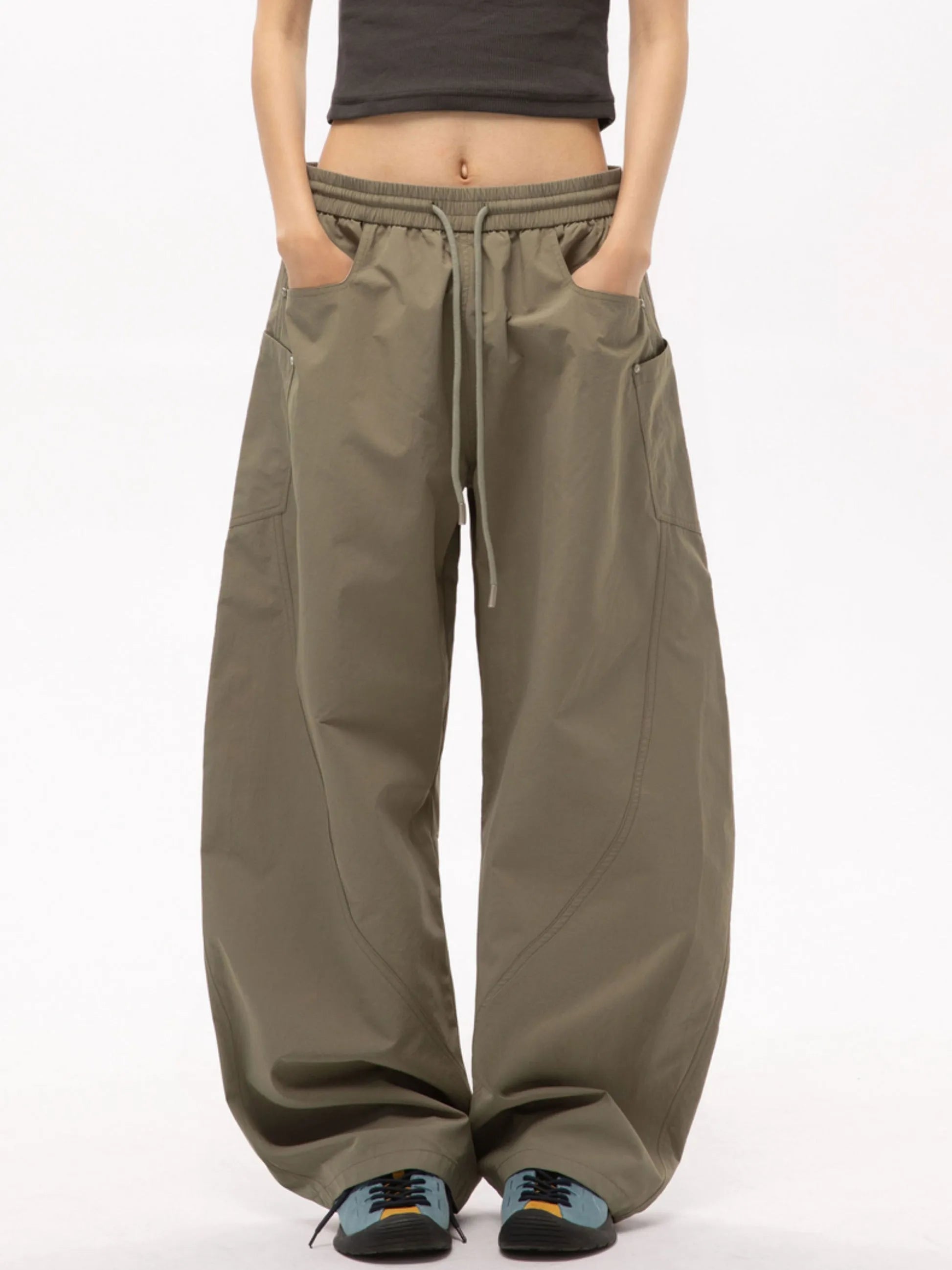 Person wearing mouse cargo pants on a white background