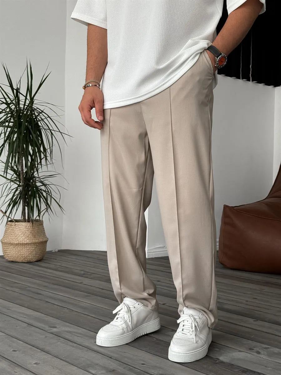 Person wearing beige office straight fit pants 