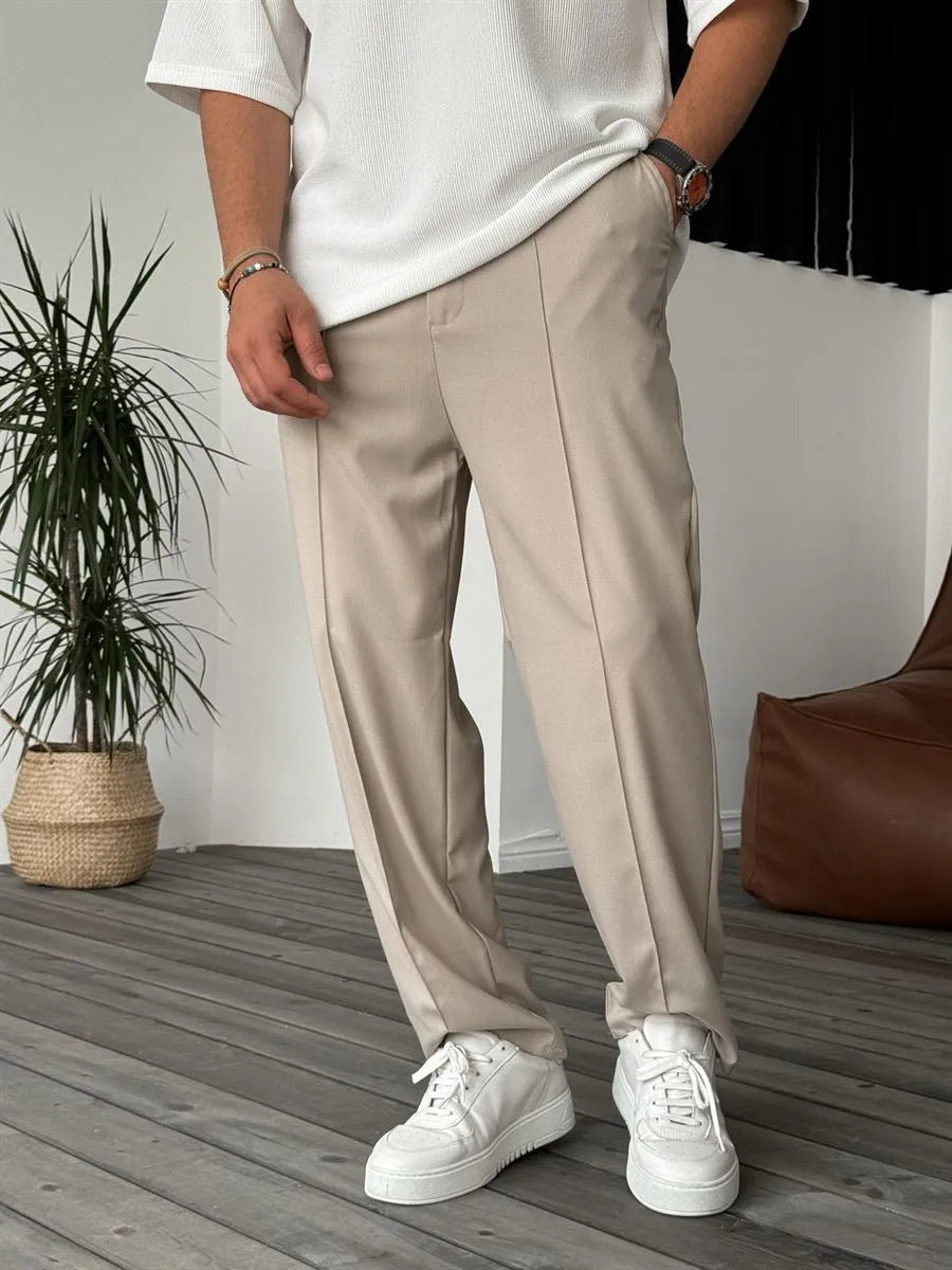 Person wearing beige office straight fit pants 