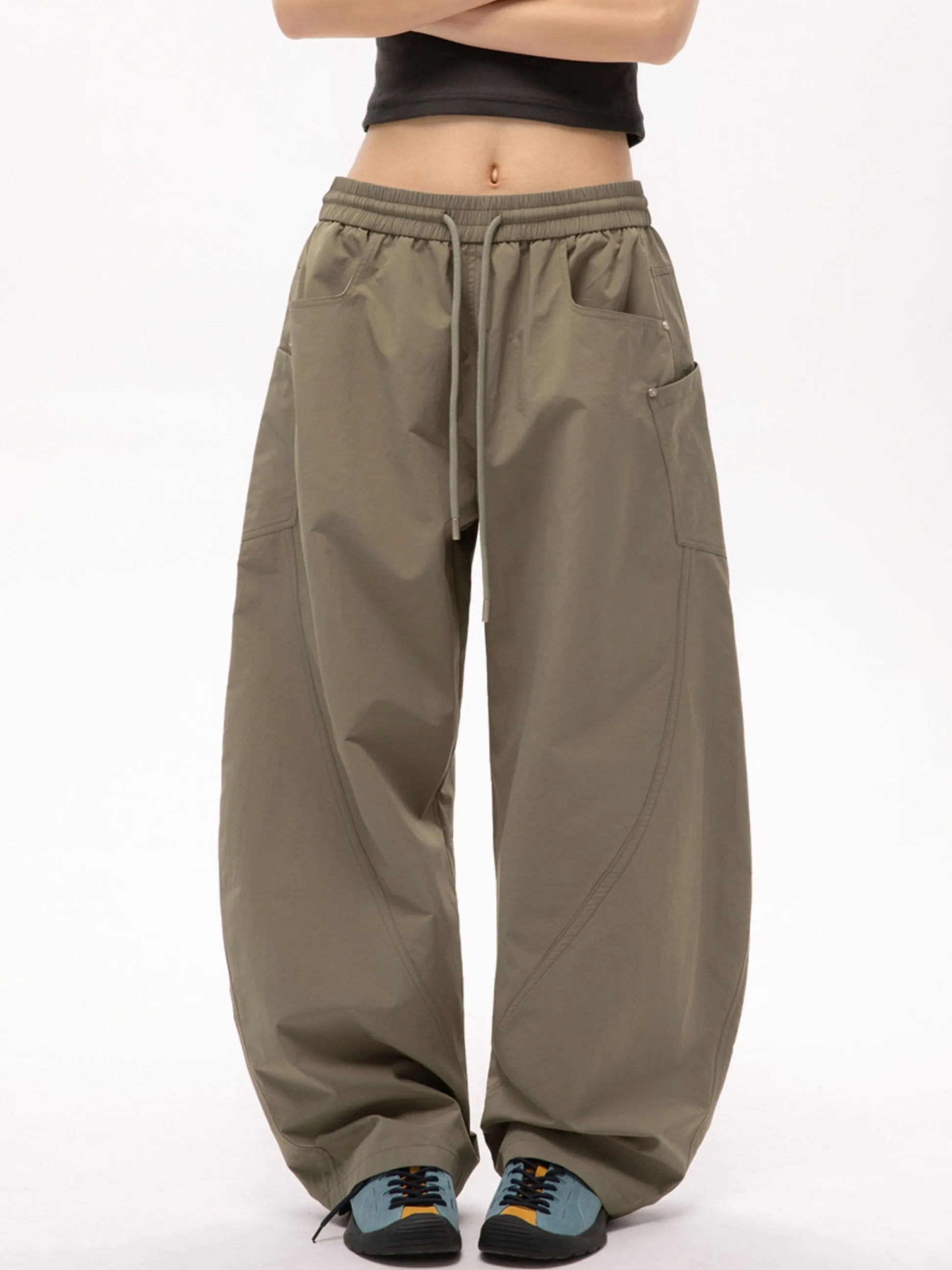 Person wearing mouse cargo pants on a white background