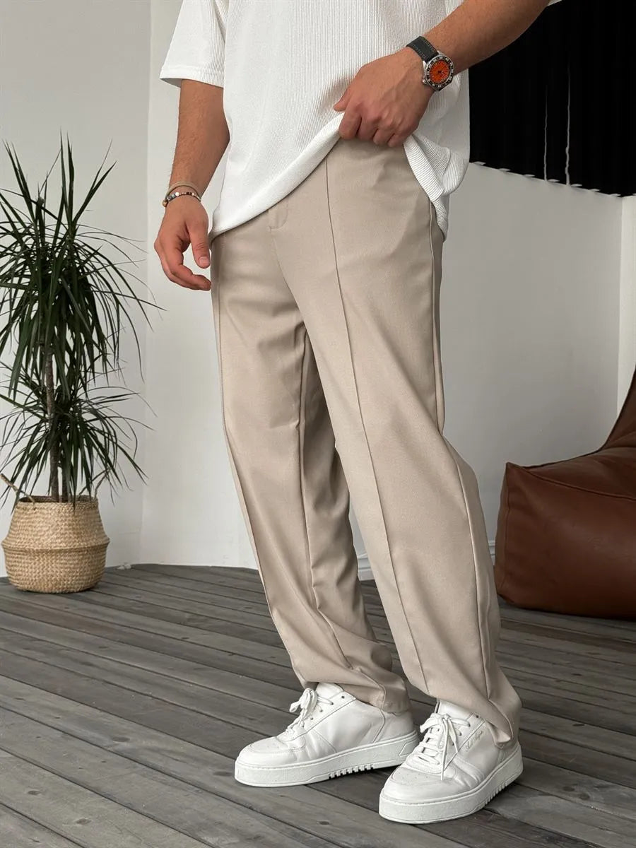 Person wearing beige office straight fit pants 