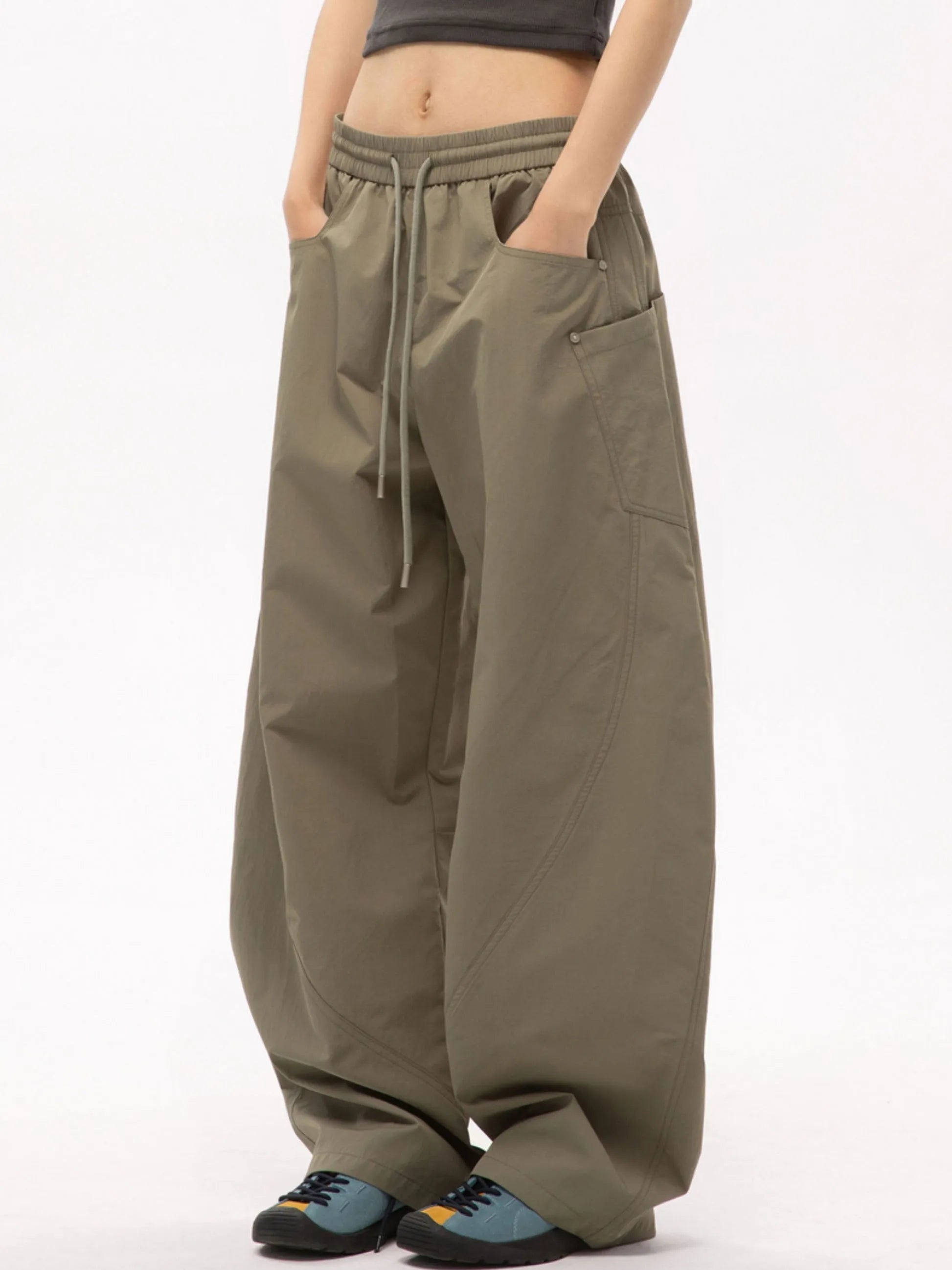 Person wearing mouse cargo pants on a white background