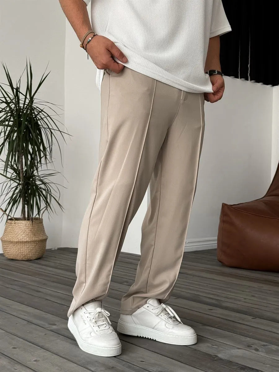 Person wearing beige office straight fit pants 