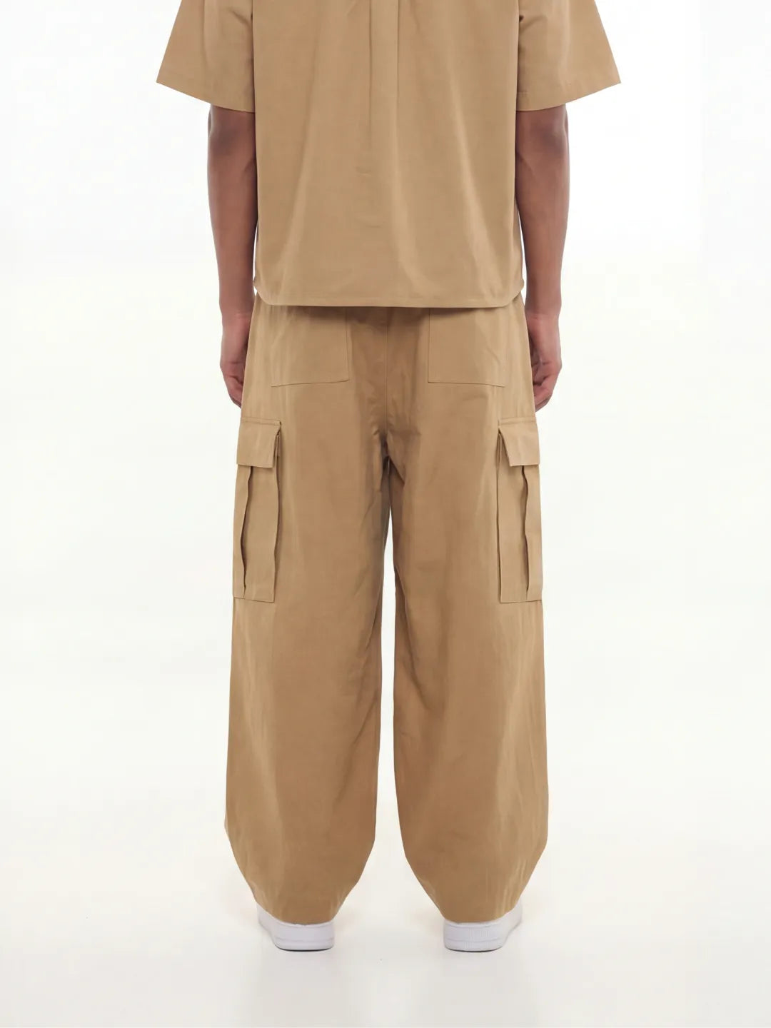Person wearing a beige cargo pants