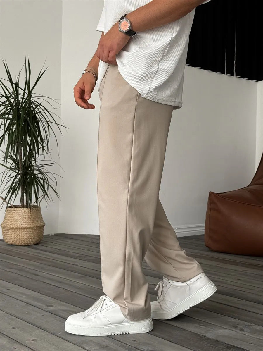 Person wearing beige office straight fit pants 