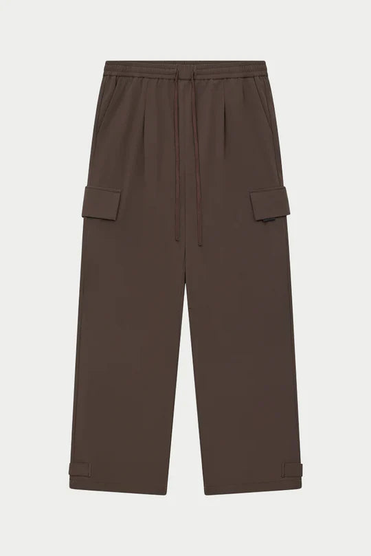 Kyoto Brown Cargo Pant is a modern utility essential designed with a relaxed wide-leg silhouette for effortless everyday wear. Crafted with a technical, structured fabric, these cargo pants balance durability with comfort, making them ideal for contemporary streetwear and elevated casual styling.