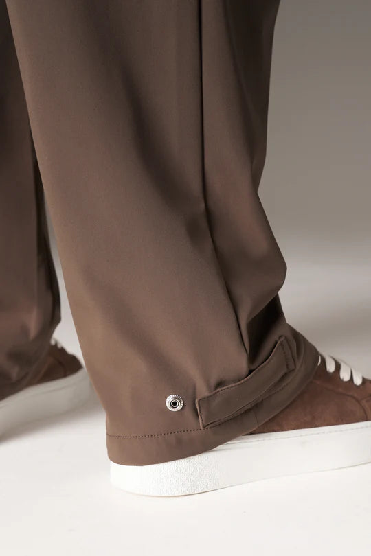 Kyoto Brown Cargo Pant is a modern utility essential designed with a relaxed wide-leg silhouette for effortless everyday wear. Crafted with a technical, structured fabric, these cargo pants balance durability with comfort, making them ideal for contemporary streetwear and elevated casual styling.