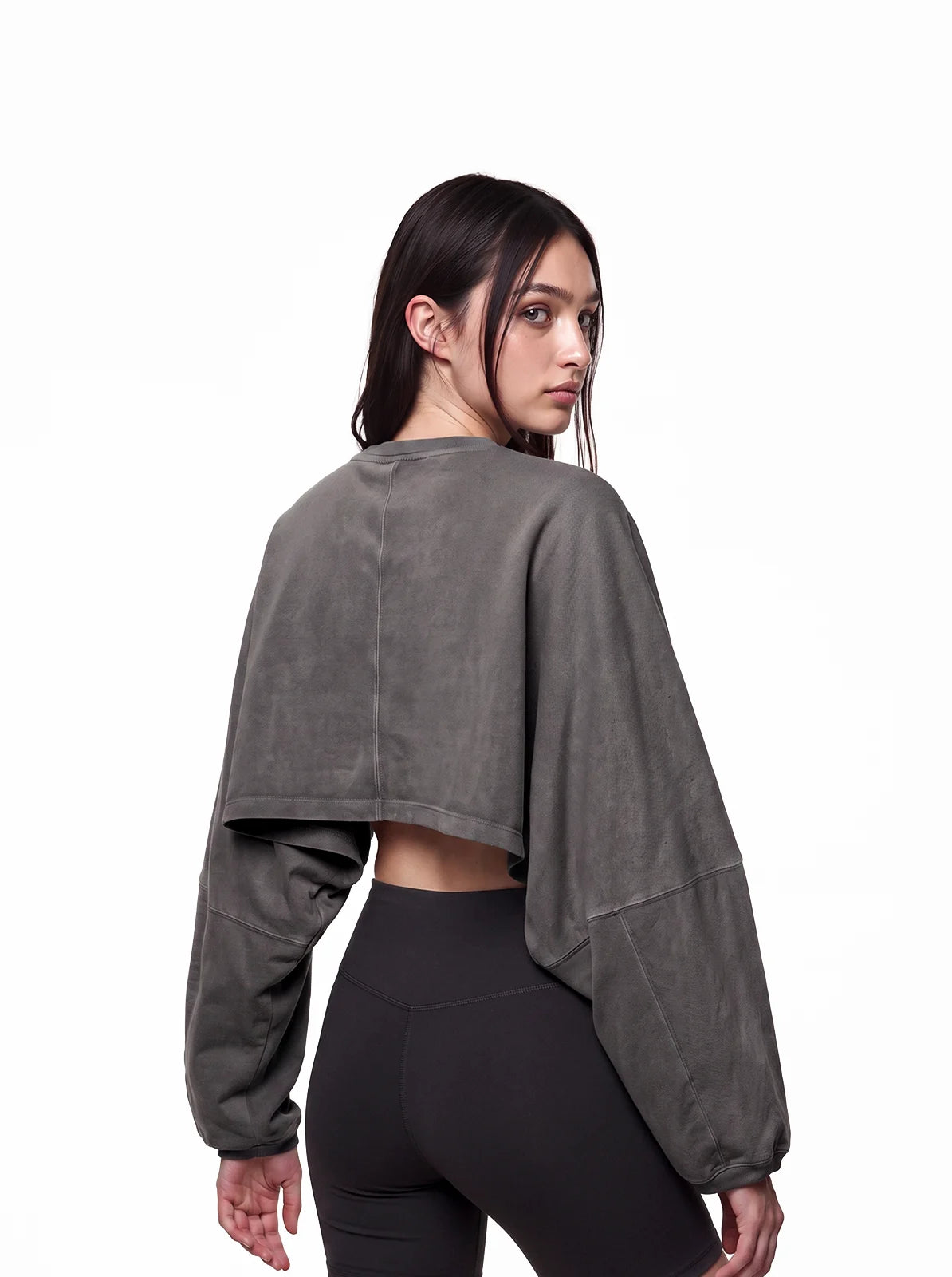 Woman wearing dark grey cult cover crop tee