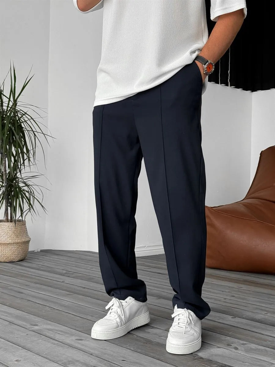 Person wearing navy blue office straight fit pants 