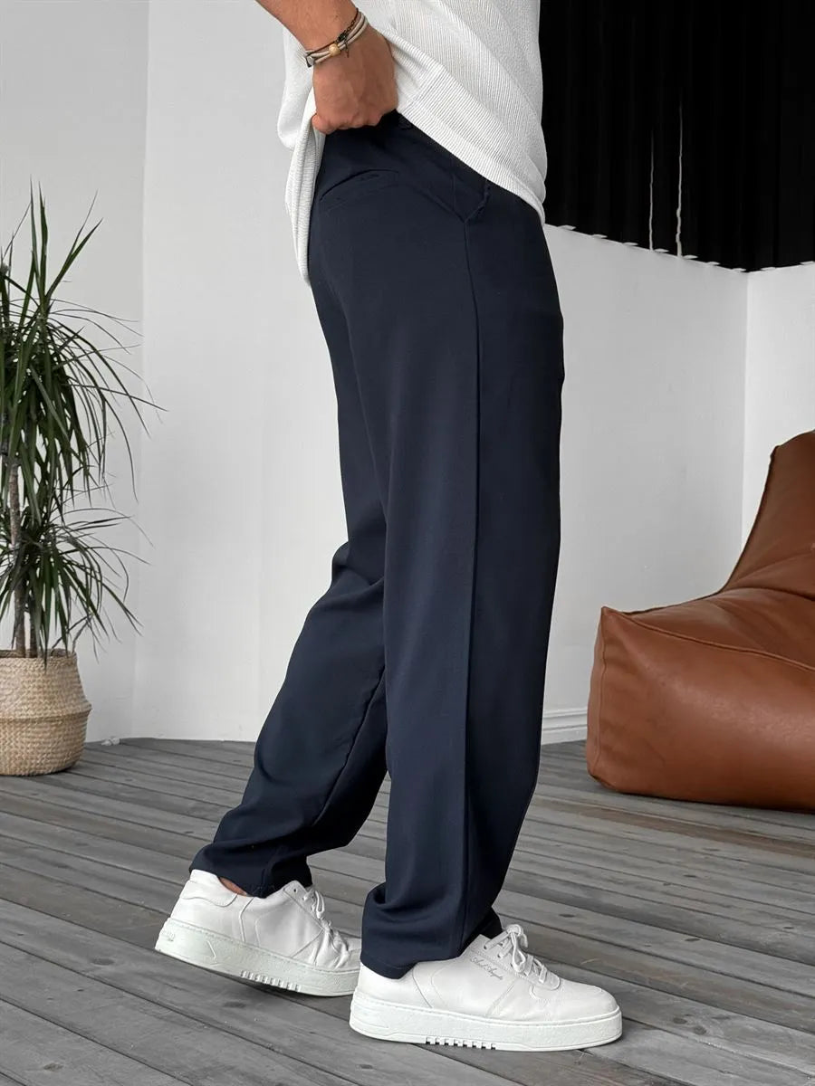 Person wearing navy blue office straight fit pants 