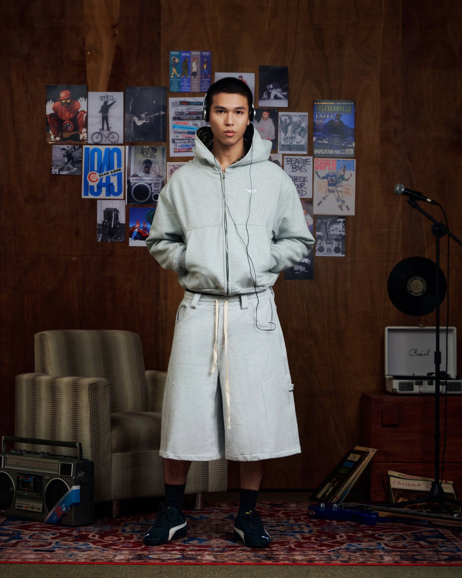 Oversized grey carpenter shorts with elastic drawstring waist and wide-leg fit