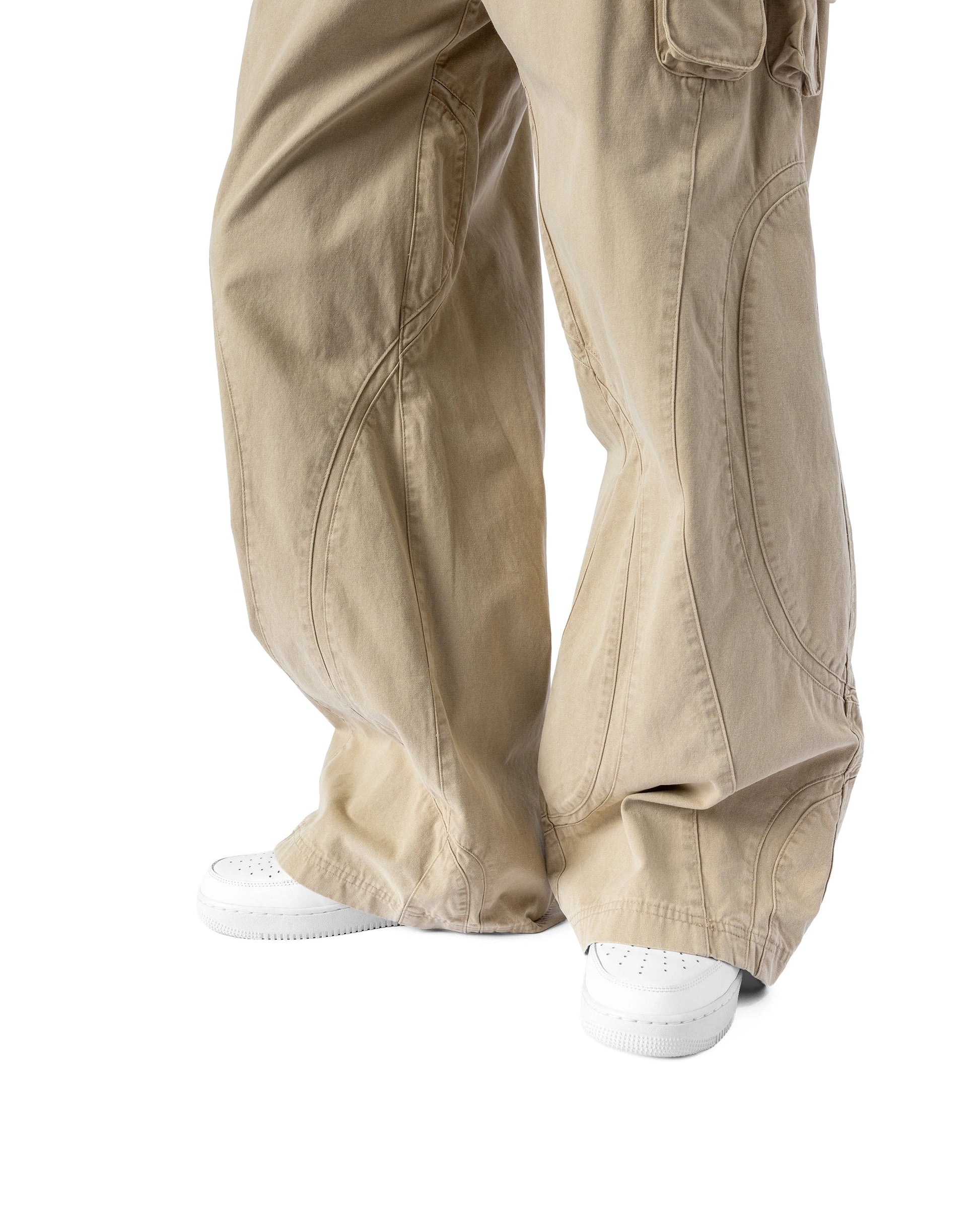 Beige cargo pants worn by a person on a white background