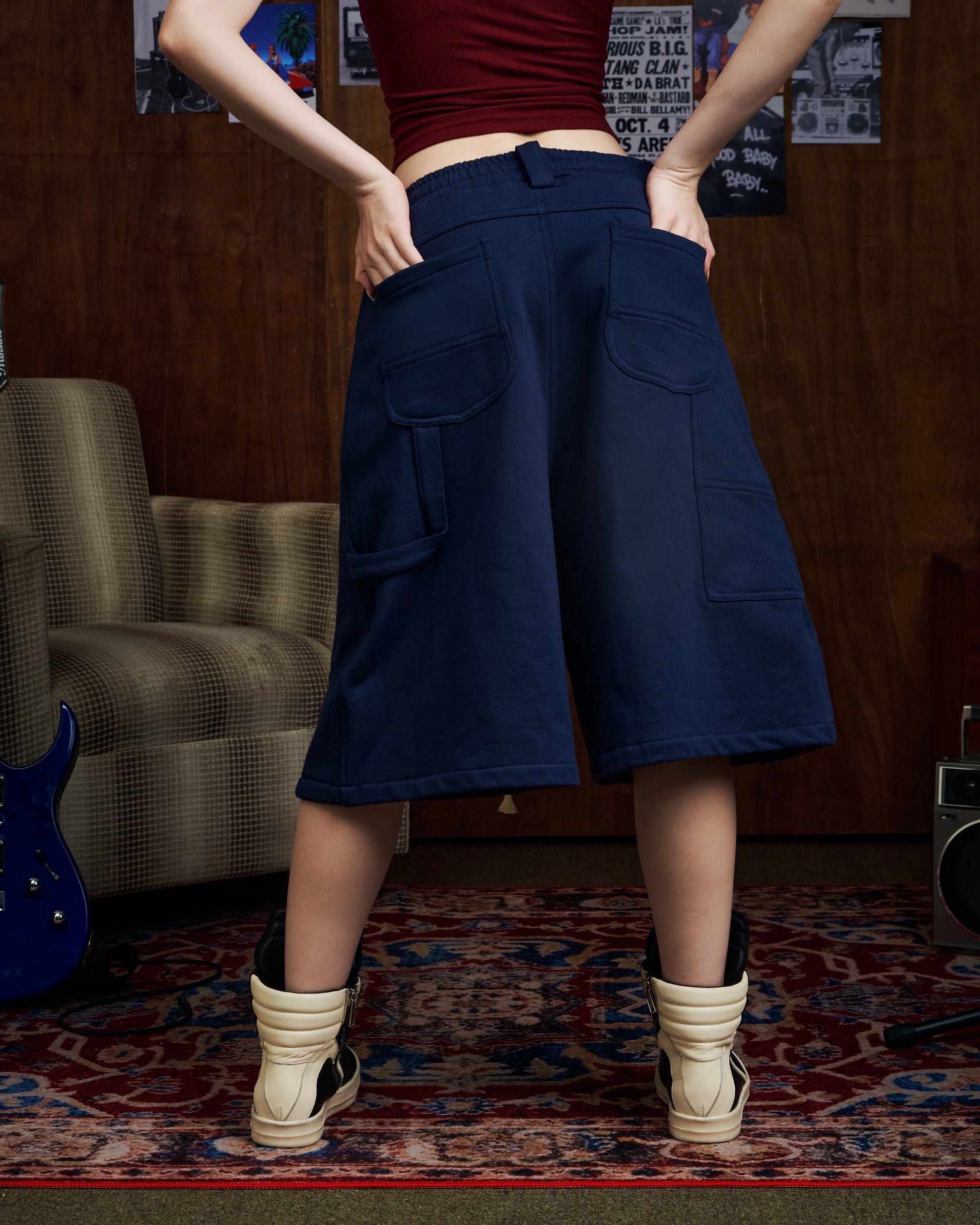 Oversized navy carpenter shorts with elastic drawstring waist and wide-leg fit