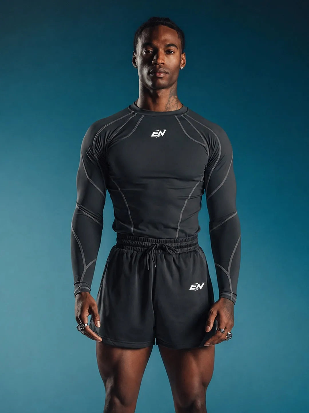 Person wearing a grey Compression Full Sleeve T-shirt with a brand logo on a blue background