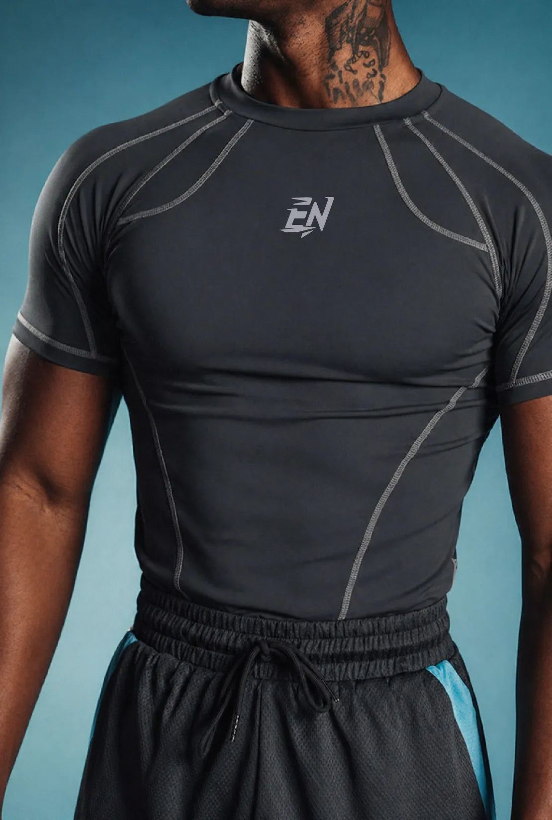 Person wearing a black athletic t-shirt with a brand logo on a blue background