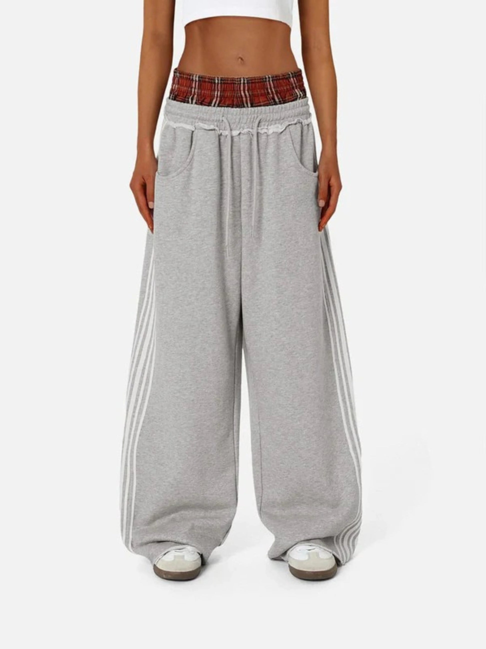 Person wearing grey boxer waist sweatpants 