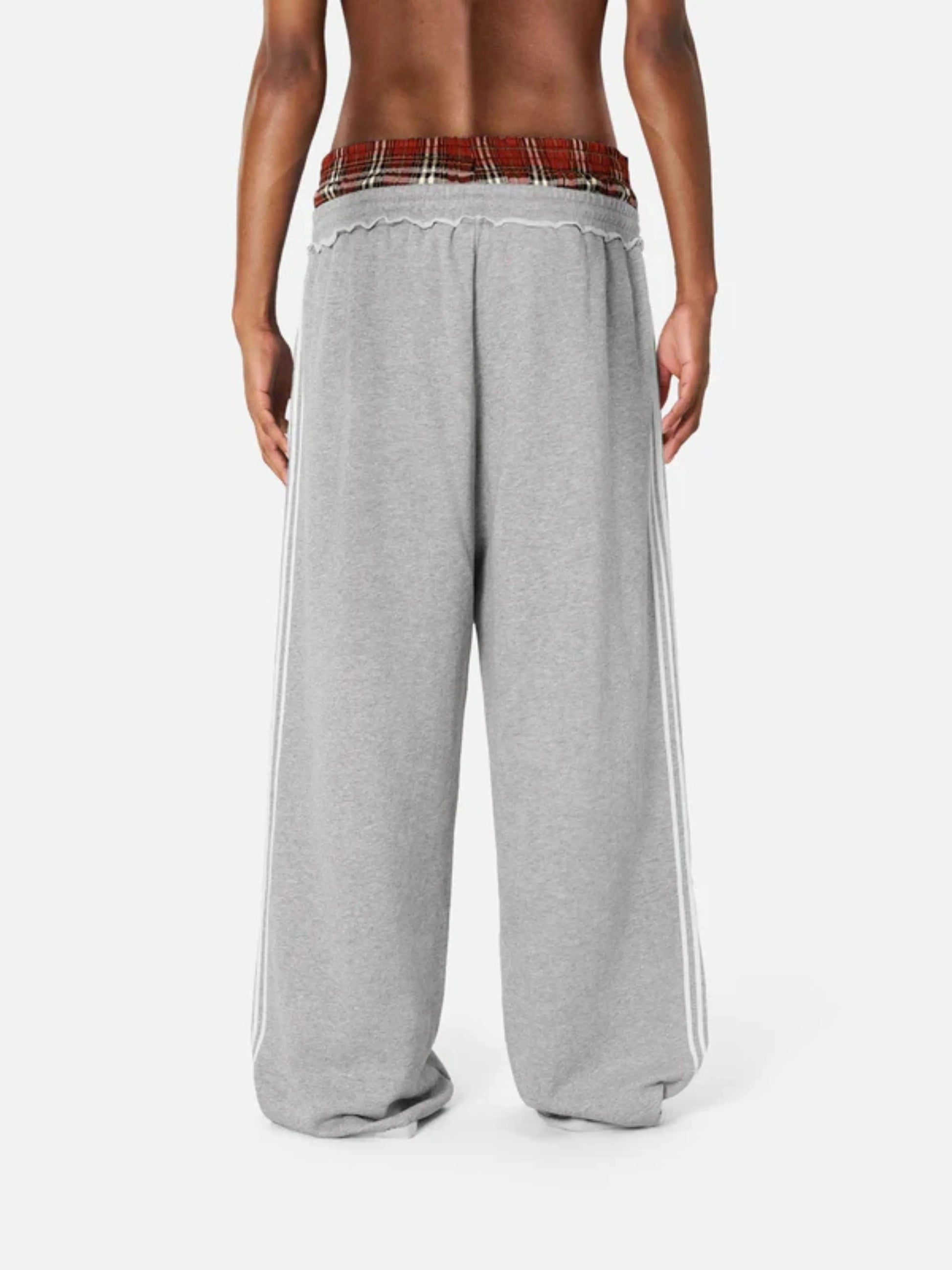 Person wearing grey boxer waist sweatpants 