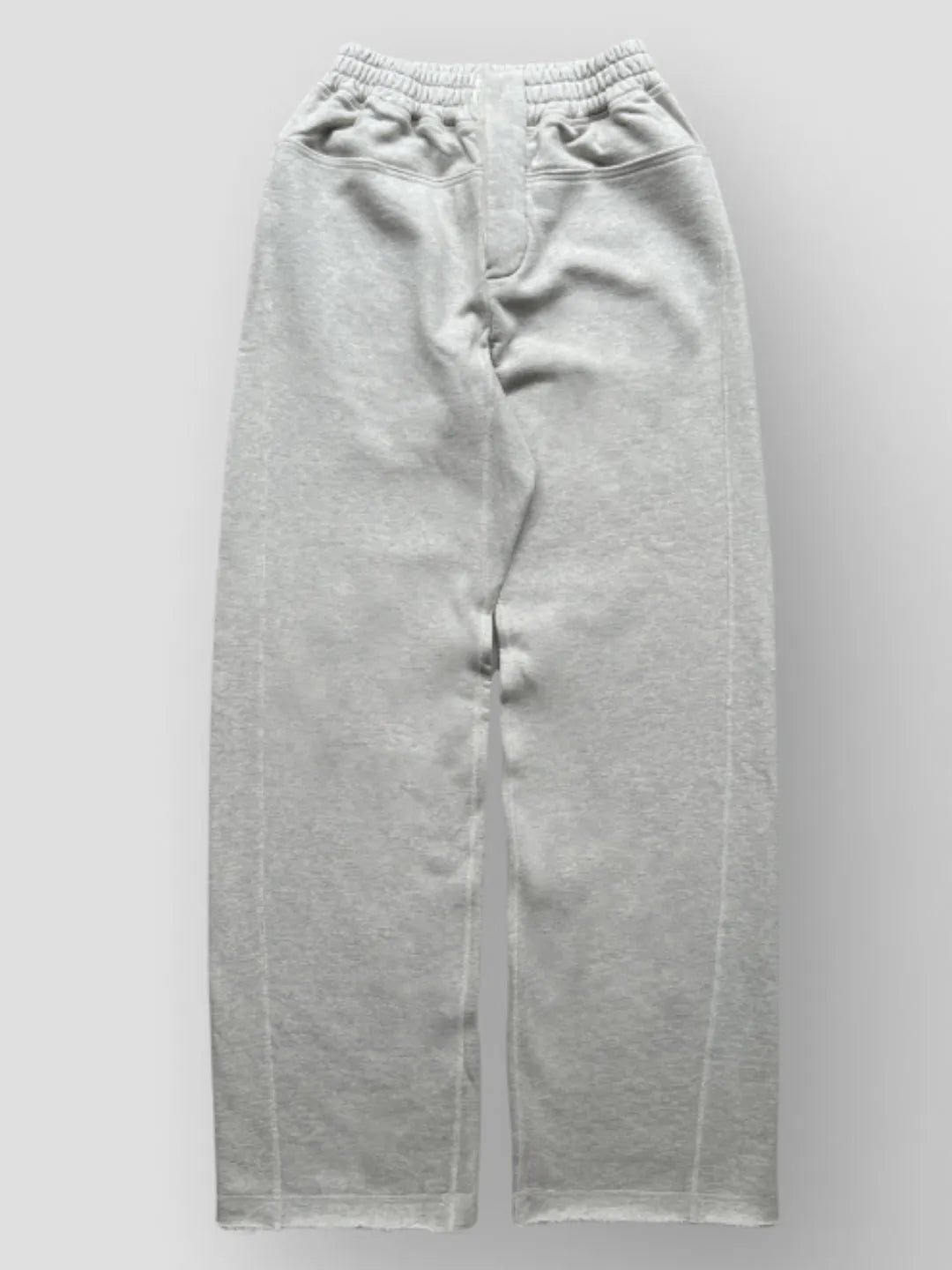 Person wearing button up grey sweatpants 