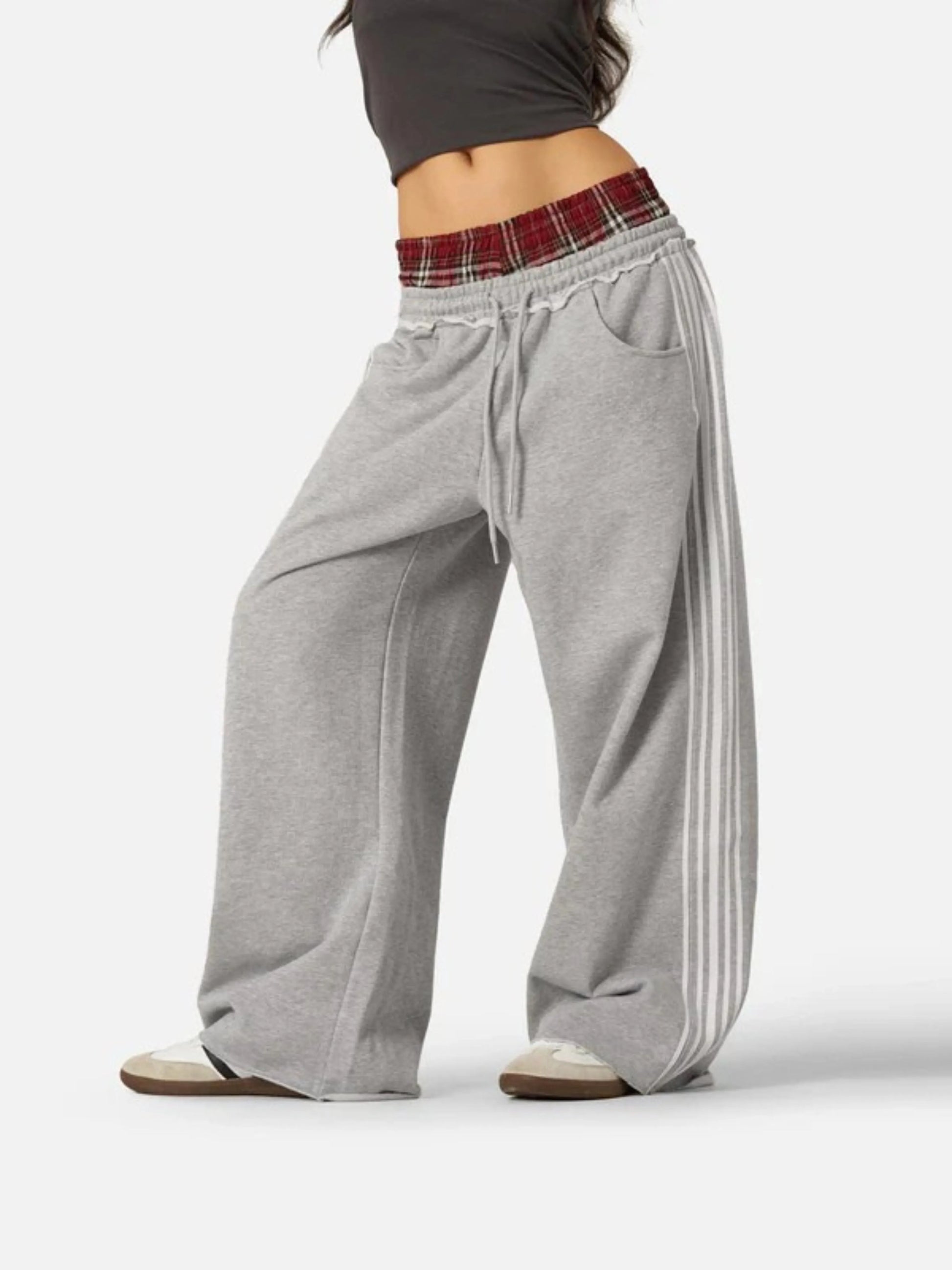 Person wearing grey boxer waist sweatpants 