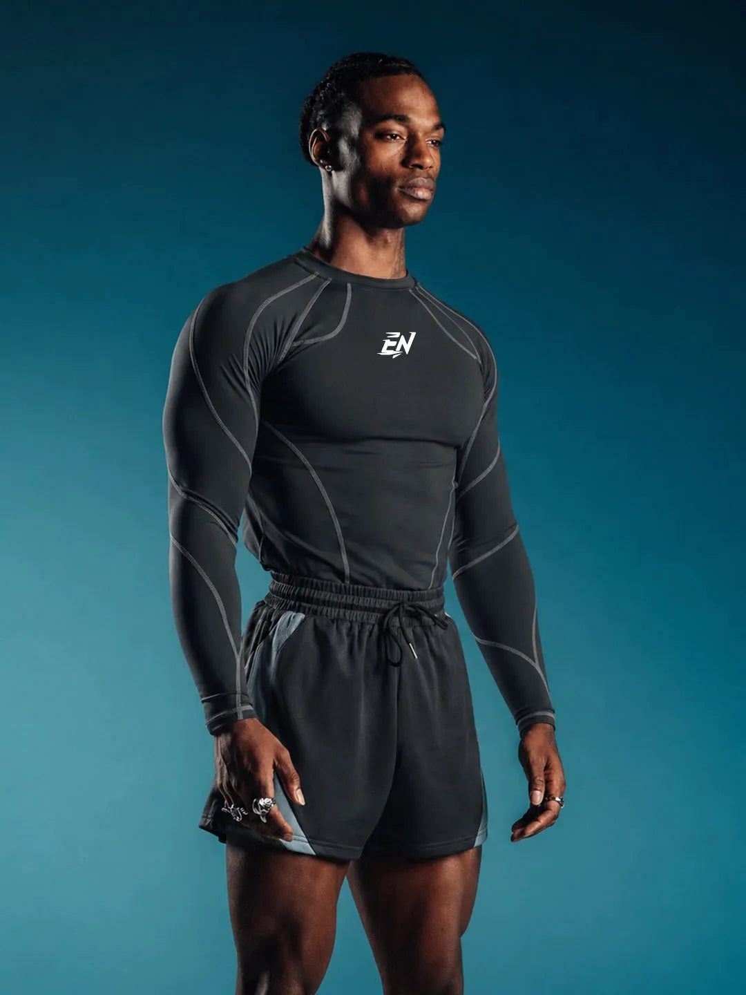 Person wearing a grey Compression Full Sleeve T-shirt with a brand logo 