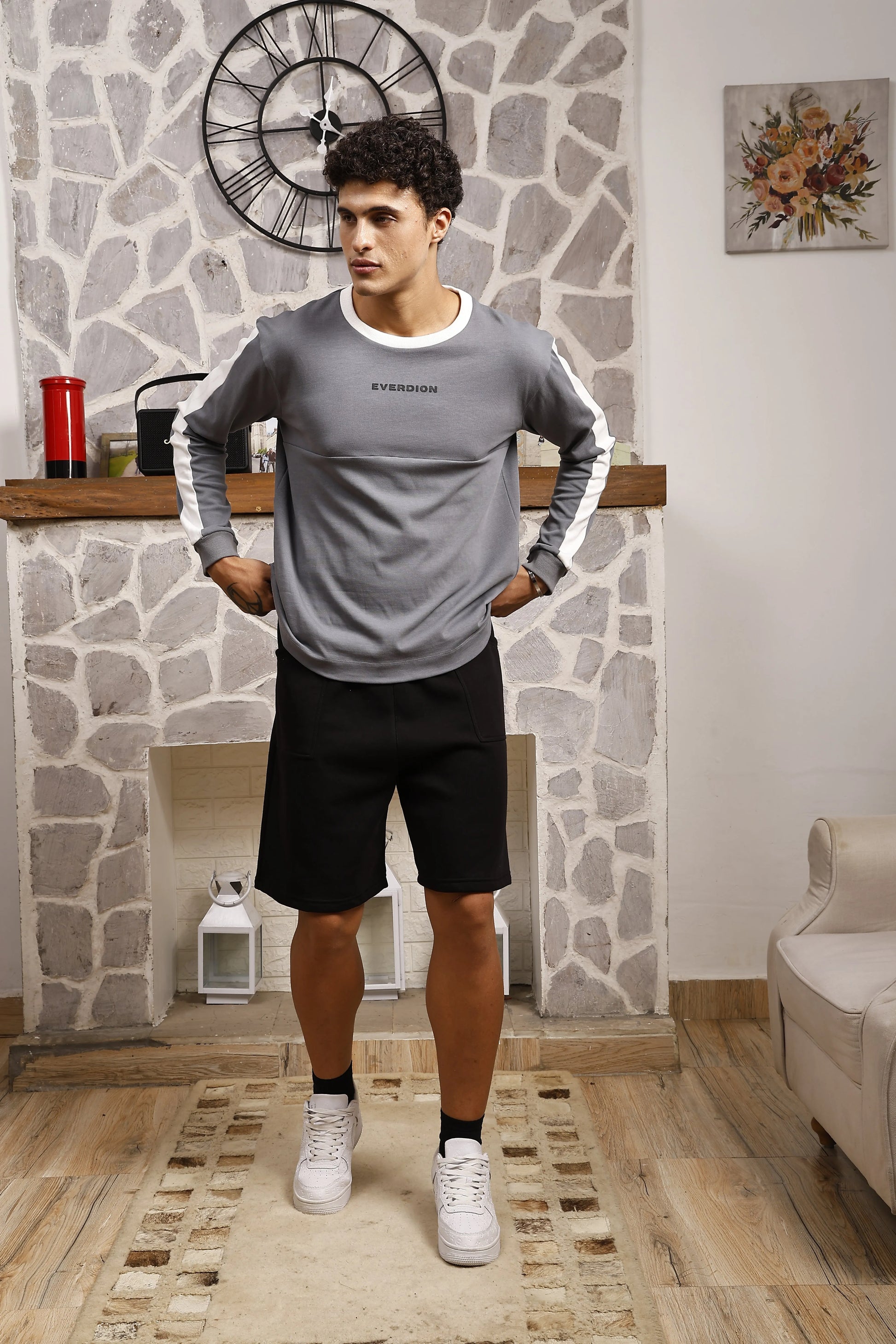 Man wearing a grey long sleeve sports t-shirt