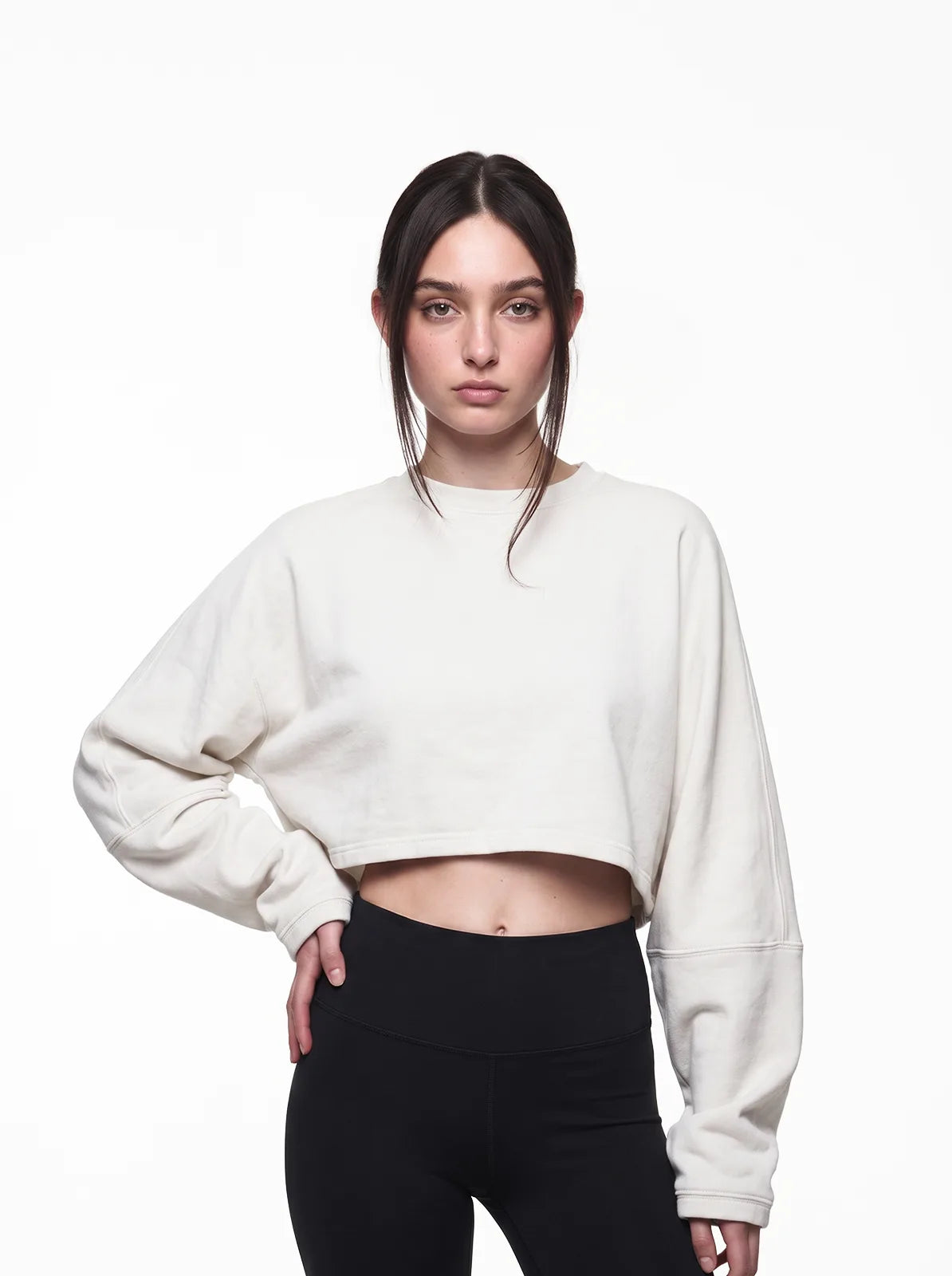 Woman wearing white cult cover crop tee