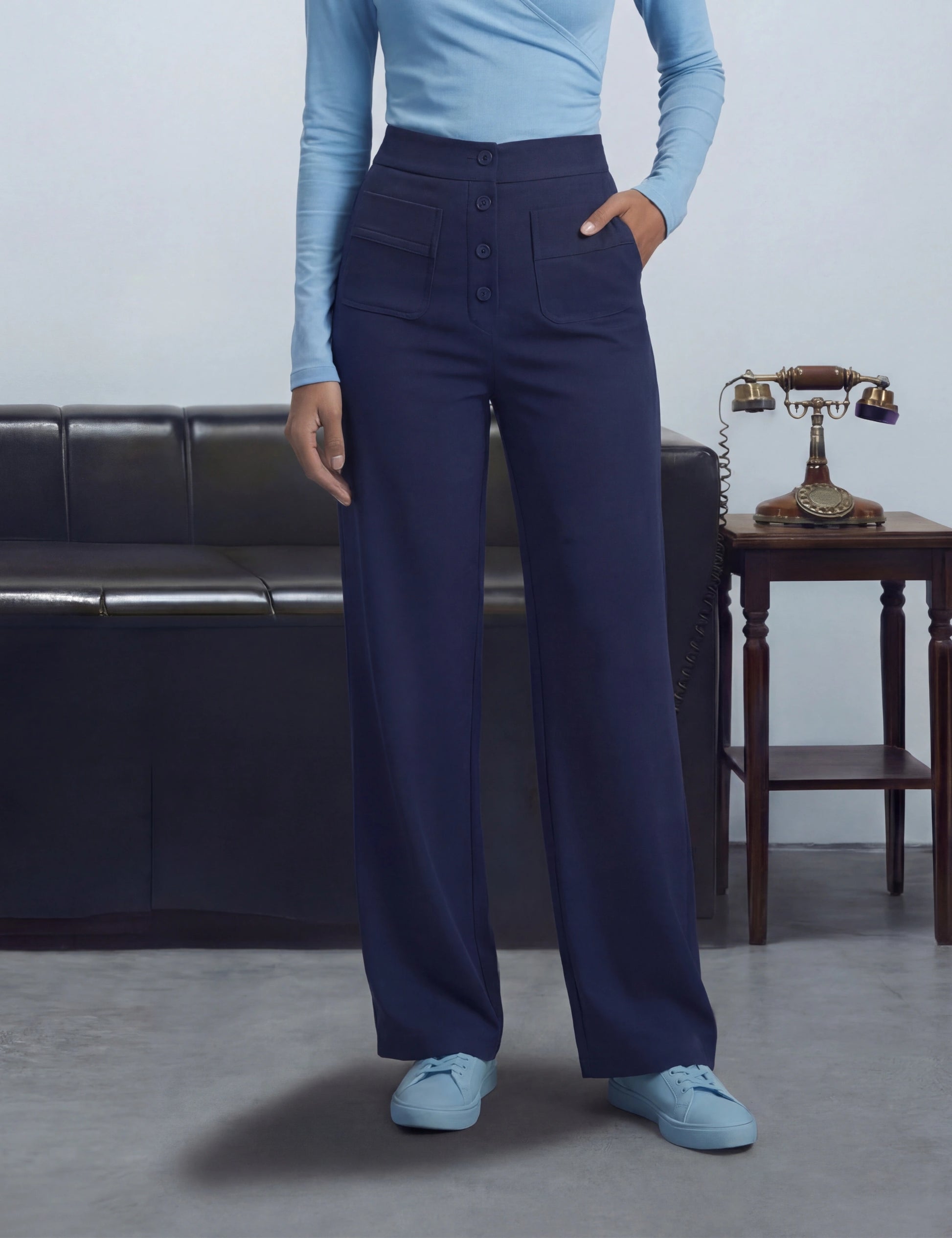 Person wearing blue pants and light blue shoes 