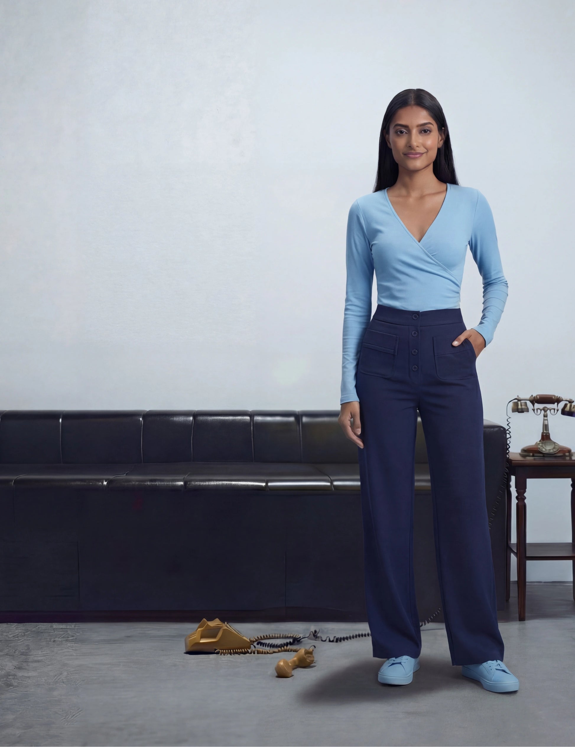 Woman in a blue top and navy pants 