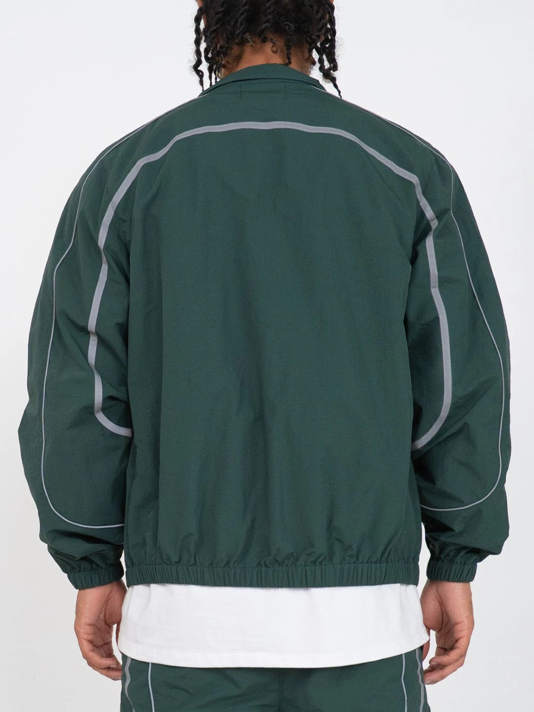 The Forest Green Jacket delivers a structured yet lightweight feel, while the relaxed-fit track pants ensure fluid movement and all-day comfort. 