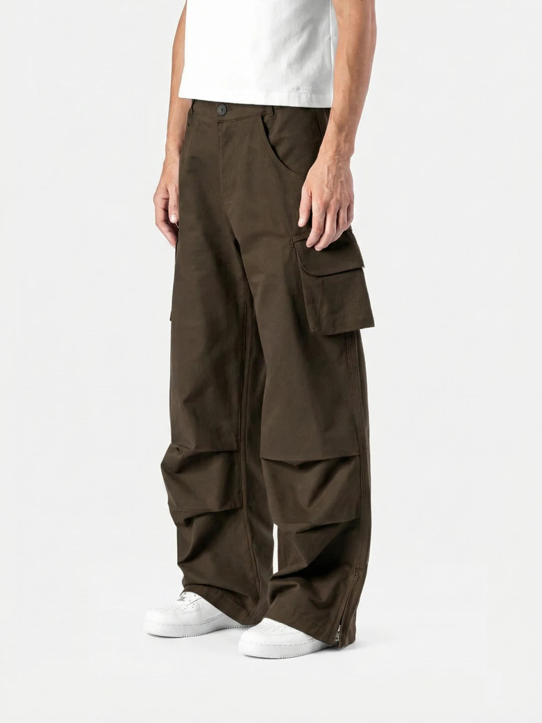 Brown Celestial Cargo bold streetwear energy with everyday comfort. With oversized utility pockets, a relaxed silhouette and elevated detailing, these pants are built for movement and presence.