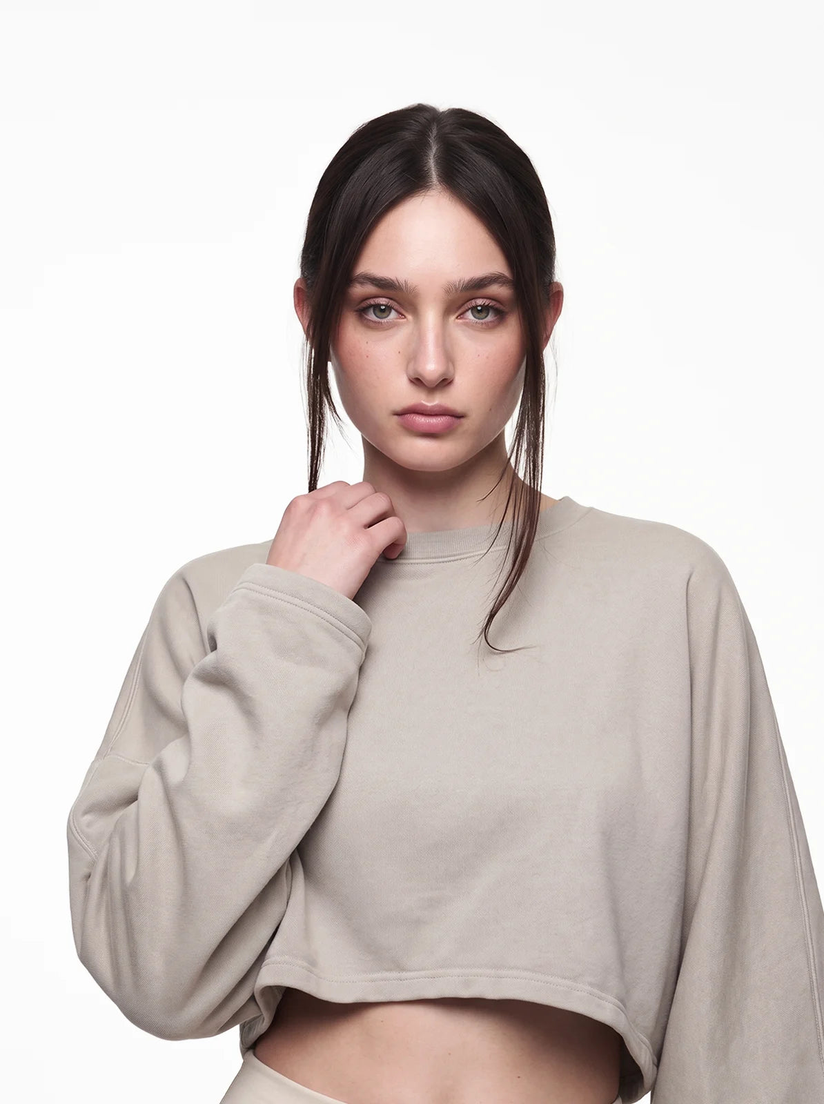 Woman wearing sand color cult cover crop tee