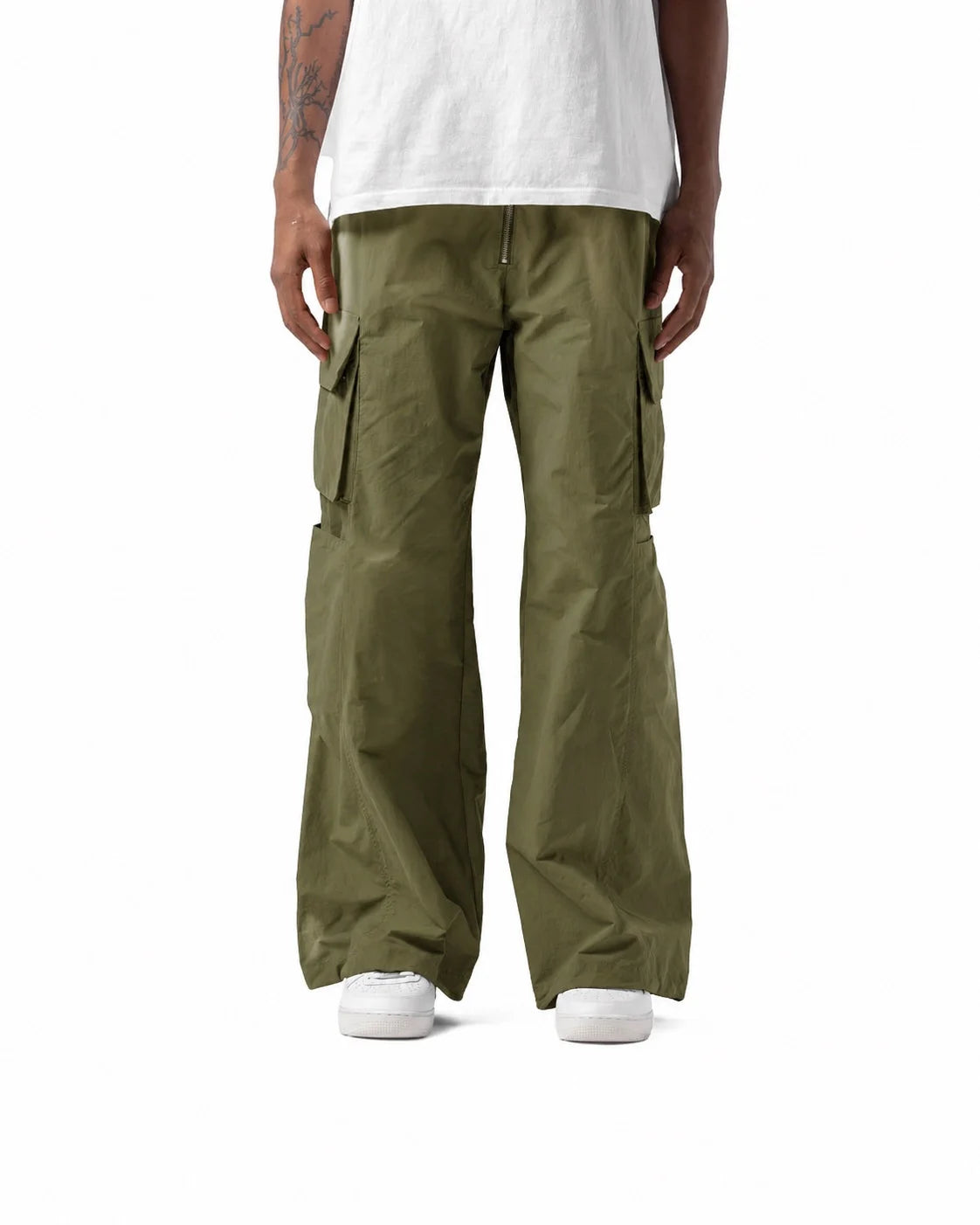 Person wearing olive green cargo pants and a white shirt on a white background
