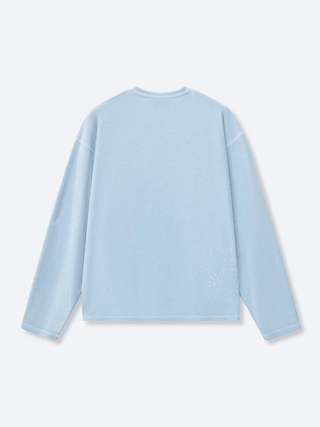 A light blue long-sleeve t-shirt shown from the back, featuring a crew neck and subtle tonal embroidery on the lower back