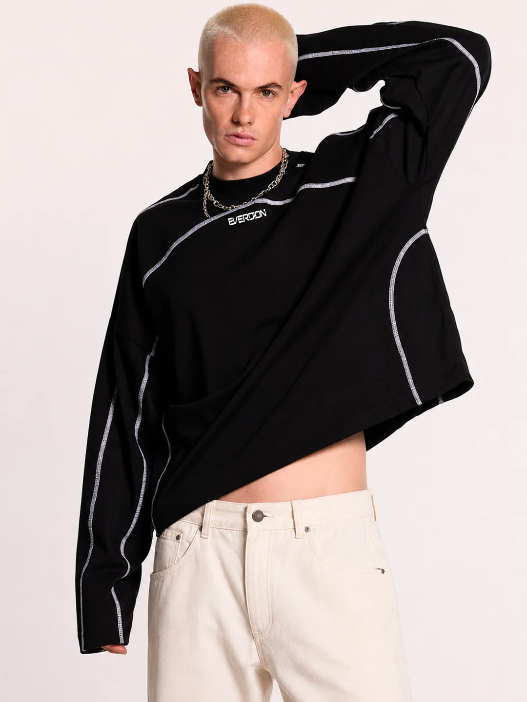 Person wearing a black long-sleeve t-shirt with white accents 