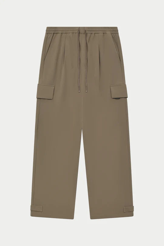 Kyoto Khaki Cargo Pant is a modern utility essential designed with a relaxed wide-leg silhouette for effortless everyday wear. Crafted with a technical, structured fabric, these cargo pants balance durability with comfort, making them ideal for contemporary streetwear and elevated casual styling.