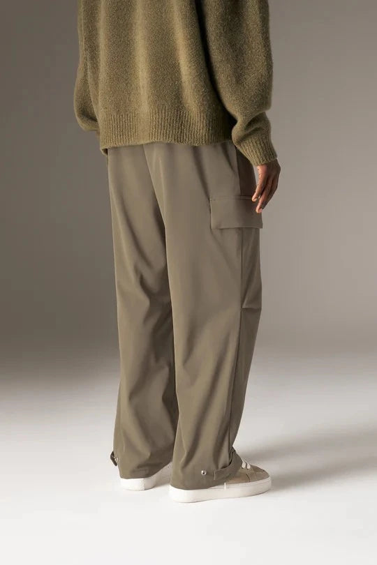 Kyoto Khaki Cargo Pant is a modern utility essential designed with a relaxed wide-leg silhouette for effortless everyday wear. Crafted with a technical, structured fabric, these cargo pants balance durability with comfort, making them ideal for contemporary streetwear and elevated casual styling.